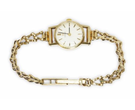 A ladies 9ct gold Omega wristwatch with integrated 9ct gold strap, gross weight 13.8g.