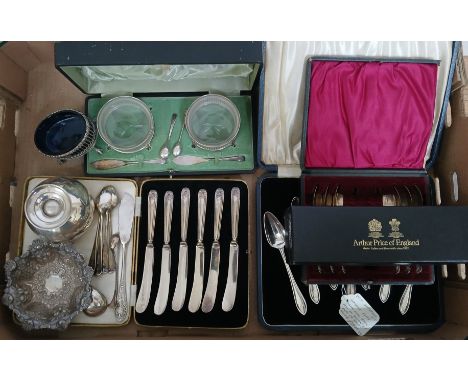 A box of mainly hallmarked silver comprising a pair of silver mounted glass preserve dishes with knives, a salt, a pedestal b