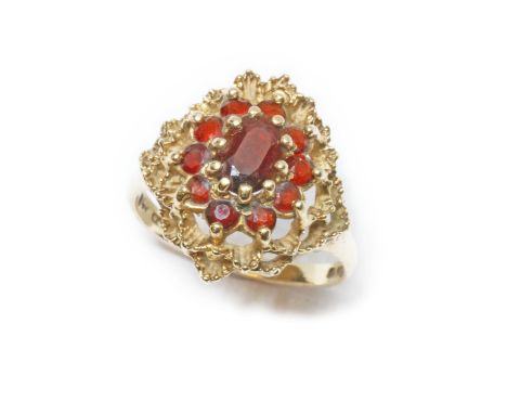 A 9ct gold garnet cluster ring, the cluster measuring approximately 18mm x 17mm, sponsor RJ, London 1972, gross weight 4.4g, 