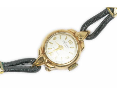 A ladies 9ct gold Accurist wristwatch with leather strap.