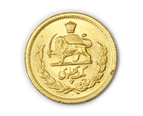 An Iranian 1 Pahlavi gold coin, with head of Mohammed Reza Shah, diameter 22mm, approx. 8.1g.