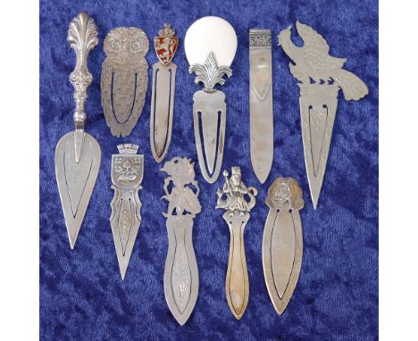 A large Edwardian silver novelty bookmark in the form of a trowel, having scrolling shell shaped handle, maker Crisford &amp;