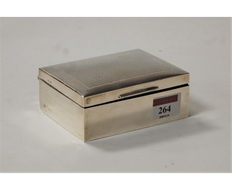 A George V silver table cigarette box, of plain rectangular form, having engine turned lid, w.11cm