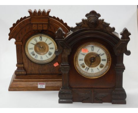 A late 19th century Ansonia Clock Company walnut cased mantel clock having an enamelled chapter ring with Roman numerals and 