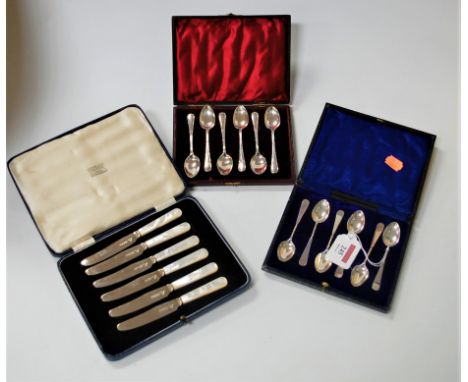 A set of six tea knives, each having silver blade and mother of pearl handle, by Garrard &amp; Co Ltd, in original Garrard's 