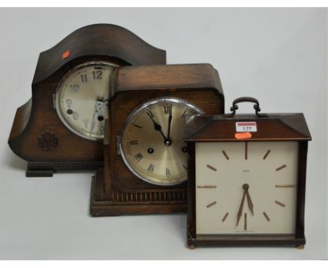 A 1930s oak cased mantel clock having a silvered dial with Roman numerals and eight day movement, together with one other oak