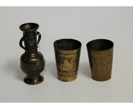 A bronzed vase, having flared rim, tapering neck and bulbous lower body, relief decorated with figures and landscape to oppos