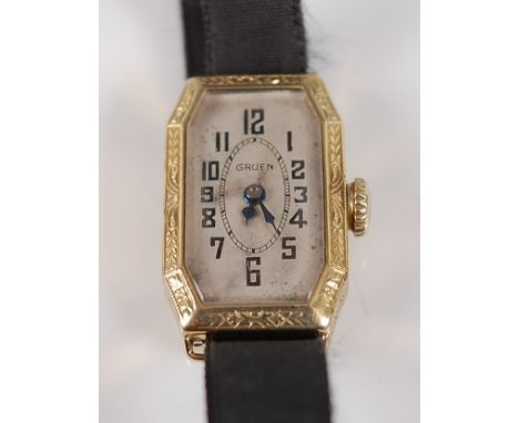 An Art Deco lady's Gruen Cincinnati 14ct gold cased tank watch, having a signed silvered dial, the case with leaf and flower 