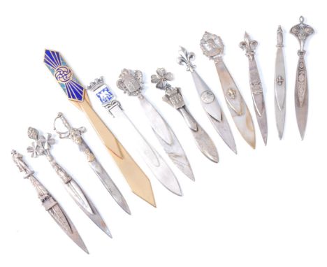 A white metal and brass mounted novelty bookmark / paper-knife in the form of a sword, the clip having applied profile portra