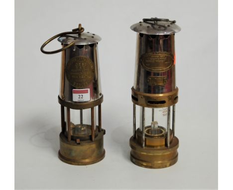 A brass miners lamp, of typical form, bearing label 'The Protector Lamp, Wrights &amp; Co Ltd', type GR6S; together with anot
