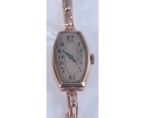 A 9ct yellow gold manual wind wristwatch, with sprung metal bracelet and oval discoloured Arabic dial, case dimensions 28 x 1