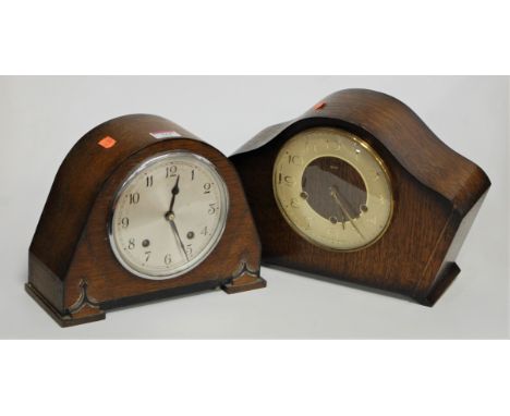 A 1950s oak cased mantel clock having a silvered dial with Arabic numerals and eight day movement, together with one other si