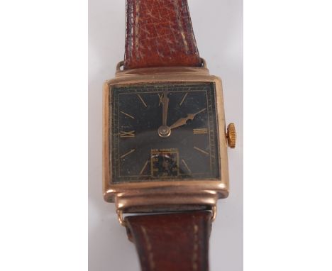 A 9ct yellow gold manual wind 'non-magnetic' wristwatch, with square black baton dial and brown leather strap, 'Trebox 15 jew