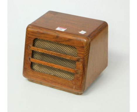 A 1950s oak cased speaker with brass grille, w.24cm
