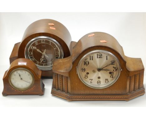 A 1930s oak mantel clock having a silvered dial with Arabic numerals and chiming movement, together with a small Edwardian ma