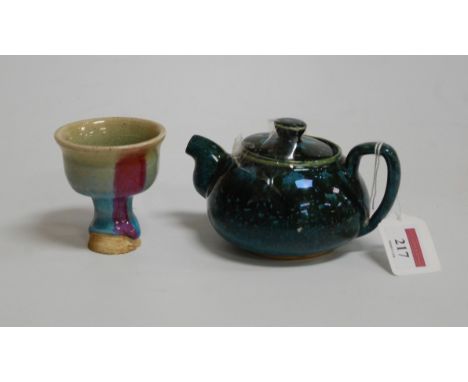 A Chinese style green and blue glazed teapot and cover, of squat circular form; together with a glazed stem cup (2)