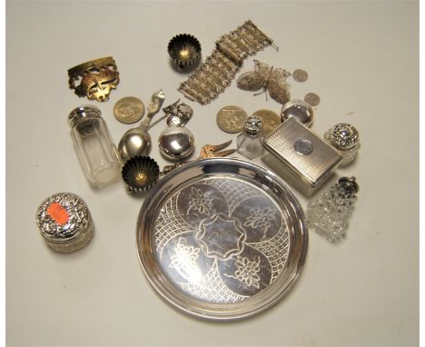 An early 20th century silver waiter, with floral decoration, London 1907; together with various silver items to include silve