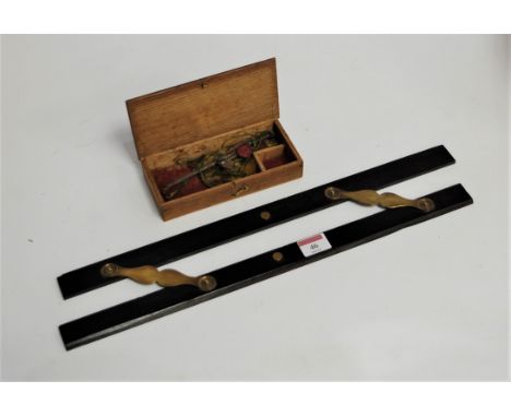 An early 20th century ebony and brass mounted folding rule; together with a set of pawnbrokers scales (2)