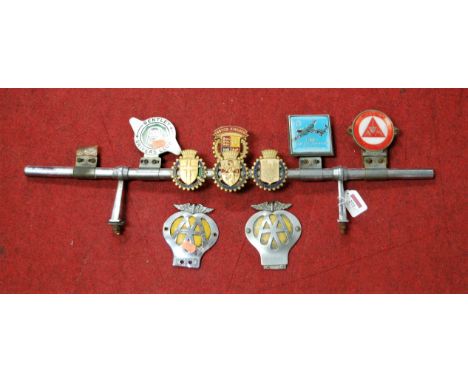A chrome car badge bar, with various car badges to include Bentley Drivers Club, Asti Automobile Club, Genova Automobile Club