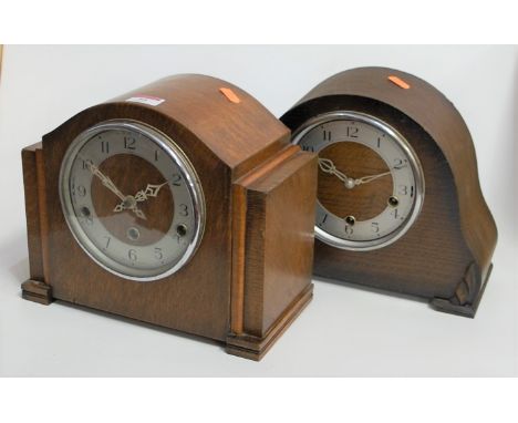 A 1940s oak cased Enfield mantel clock, having a silvered chapter ring with Arabic numerals and chiming movement striking on 