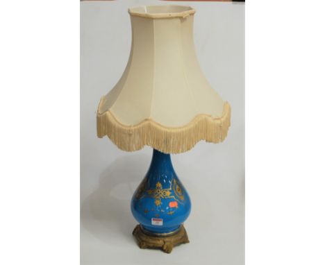 A French style blue glazed and gilt metal mounted table lamp, having applied gilt and enamel decoration, with shade, h.48cm (