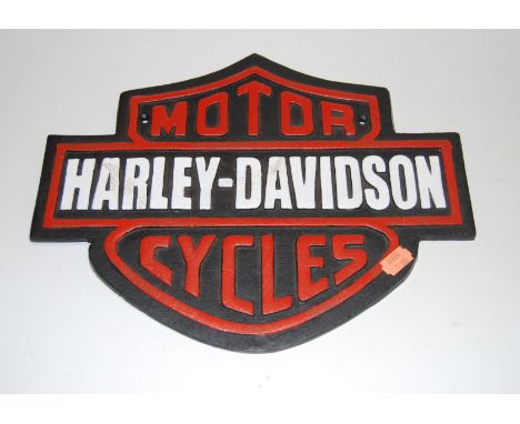 A reproduction cast iron Harley Davidson Motorcycles advertising sign