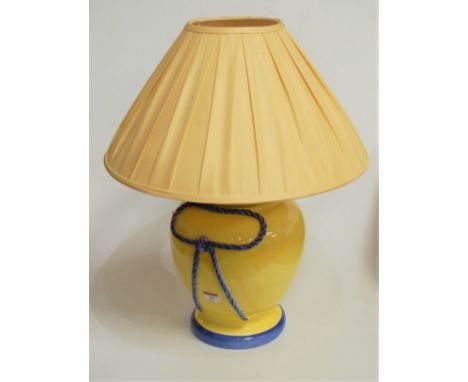 A large modern table lamp, of baluster form, on a yellow ground with blue ropetwist decoration, having pleated silk shade, h.