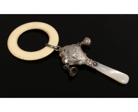 A silver and mother of pearl rattle and teether, assayed Chester 1958.