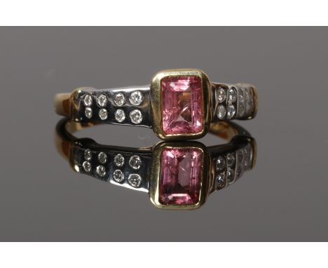 A 9ct gold ring set with a pink sapphire and diamond, size N. assayed sheffield 1999, maker's mark M Ltd