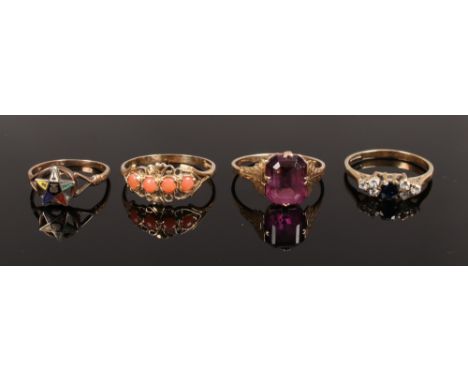 Four 9ct gold dress rings, amethyst, coral and enamel etc.