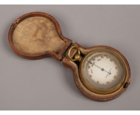 A 19th century cased brass pocket barometer with silvered dial signed Short &amp; Mason Ltd London.Condition report intended 