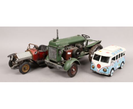 Three decorative tin plate model vehicles, a tractor, car and camper van.