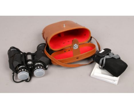 A Fujifilm compact camera, along with a cased set of Enbeeco binoculars.