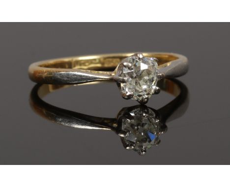 An 18ct gold solitaire diamond ring set with and old mine cut diamond approximately 0.3ct, size C.