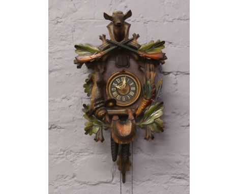 A German early - mid 20th century Black Forest cuckoo clock with twin train movement.