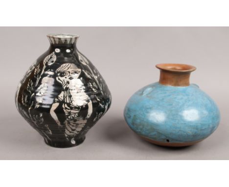 A painted terracotta flask along with a studio decorated bottle vase. (black and white vase approx 22cm high)Condition report