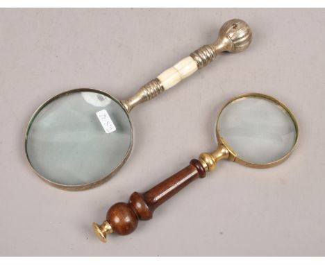 Two magnifying glasses, one turned handle the other mother of pearl effect.