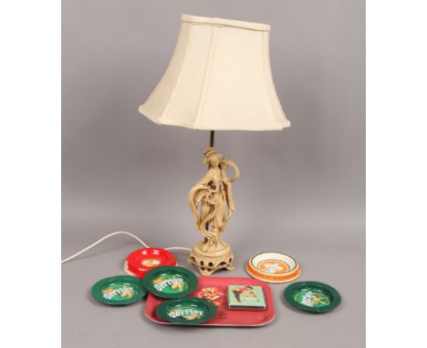 A composite figural table lamp in the form of a geisha girl, along with a collection of reproduction advertising ashtrays and