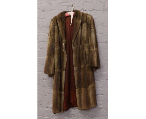 A ladies vintage full length fur coat.