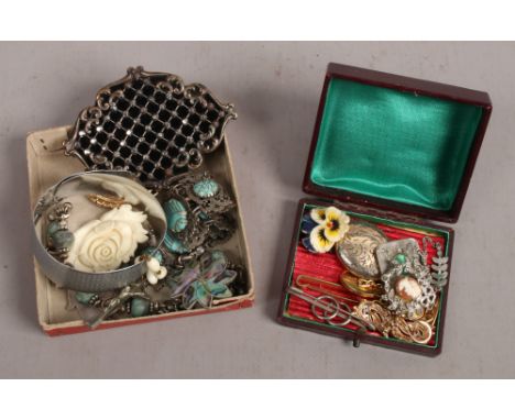 Two boxes of miscellaneous costume jewellery including brooches, tie pins, cuflinks, locket etc.