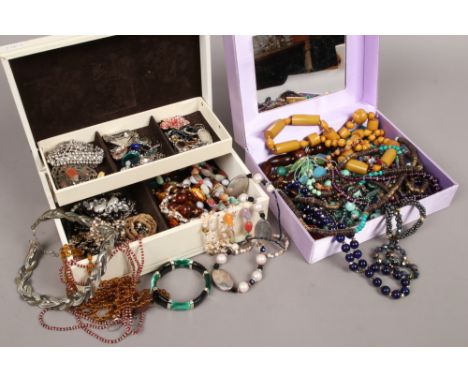 Two cases of costume jewellery to include earrings, beads, necklaces etc.