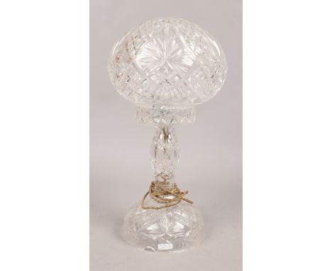 A cut glass table lamp.