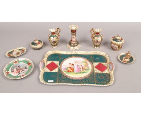 A quantity of Vienna porcelain including twin handled tray, candlestick, trinket dishes etc.Condition report intended as a gu