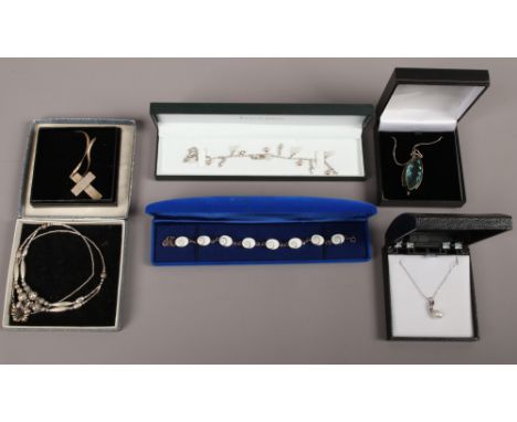 Six pieces of silver jewellery including a cultured pearl pendant on chain, bracelets etc all boxed.