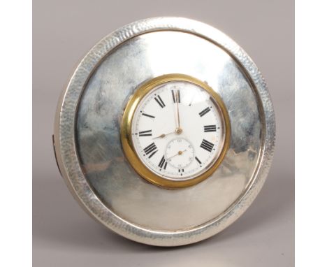 A silver mounted strut clock having a pocket watch movement with enamel dial and subsidiary seconds, assayed Birmingham, mark