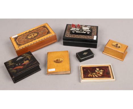 A quantity of wooden trinket boxes including Mauchline ware examples.