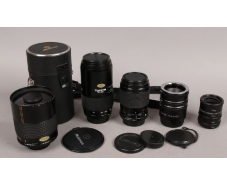 A box of vintage camera lenses to include cased Makinon example etc.