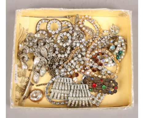 A small box of costume jewellery to include brooches, pendants and neck ware.