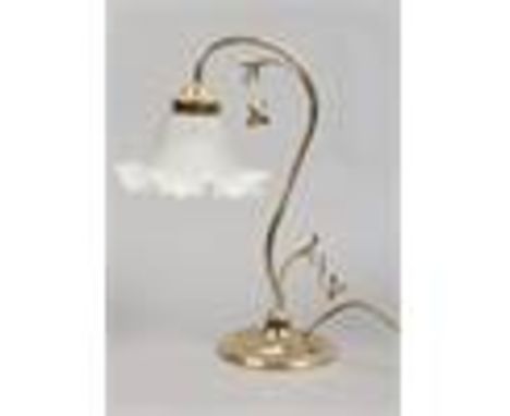 A brass effect table lamp of floral form with opaque glass shade.