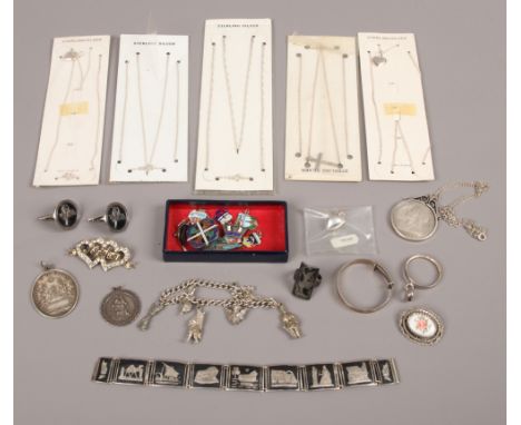 A box of vintage and old silver jewellery including Victorian coin pendant on chain, enamelled charms and Niello panel bracel